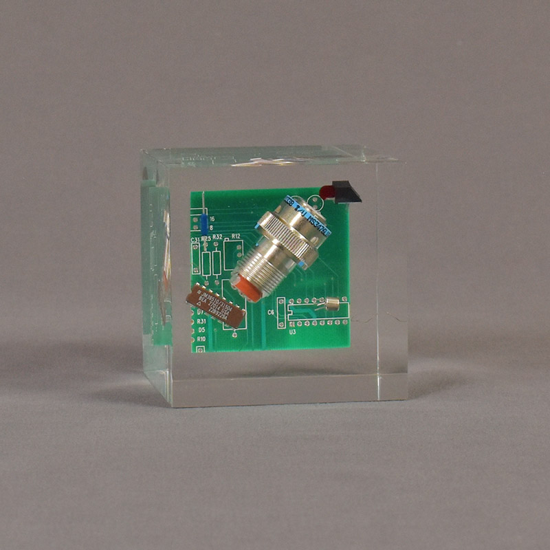 Computer board and component cast into a Lucite® Acrylic Block.